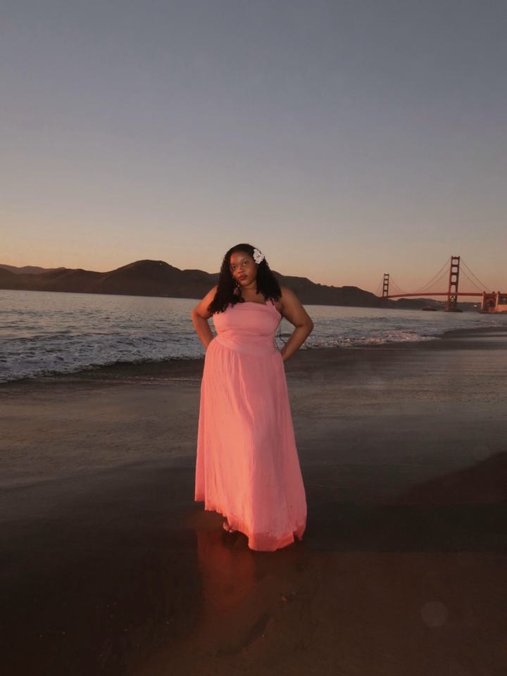 Rachel on a beach at sunset